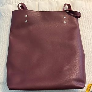 Maroon colored sack bag.